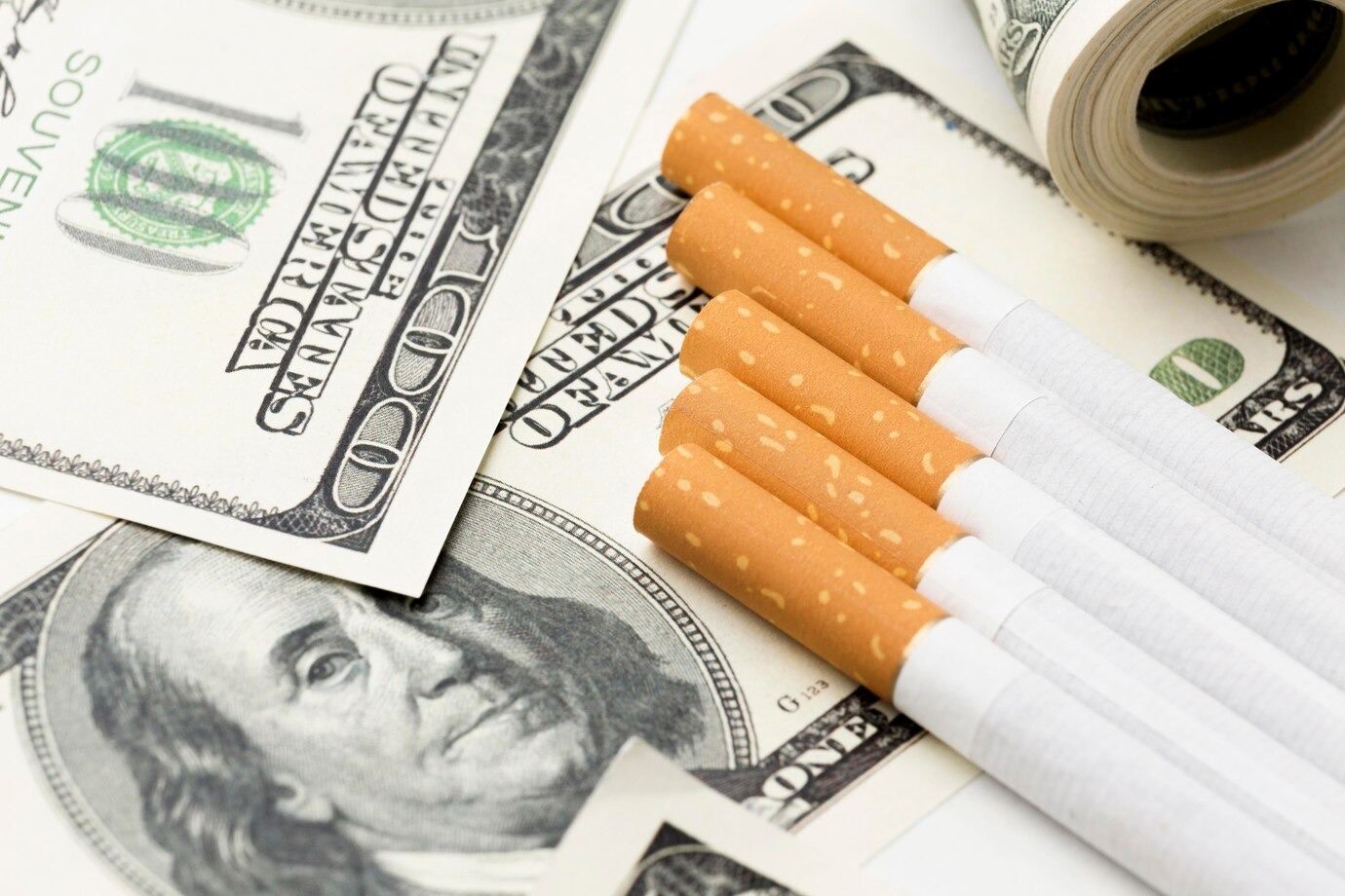 cigarettes and dollars bills